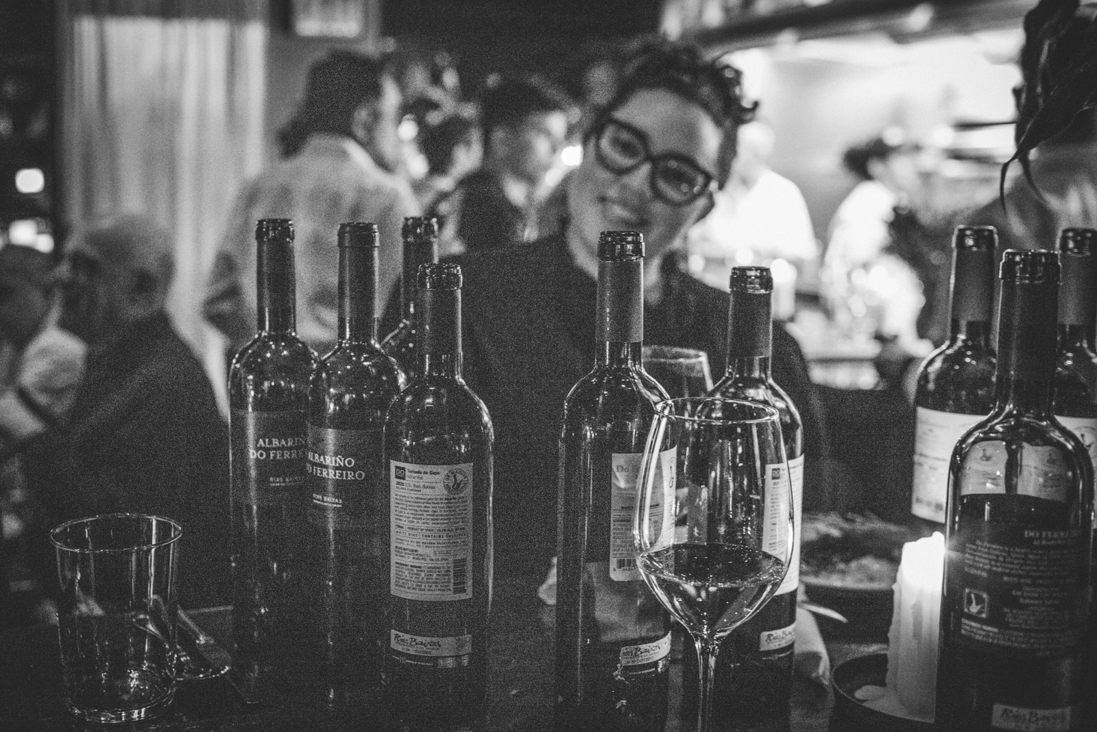 a group of people sitting at a table with wine glasses