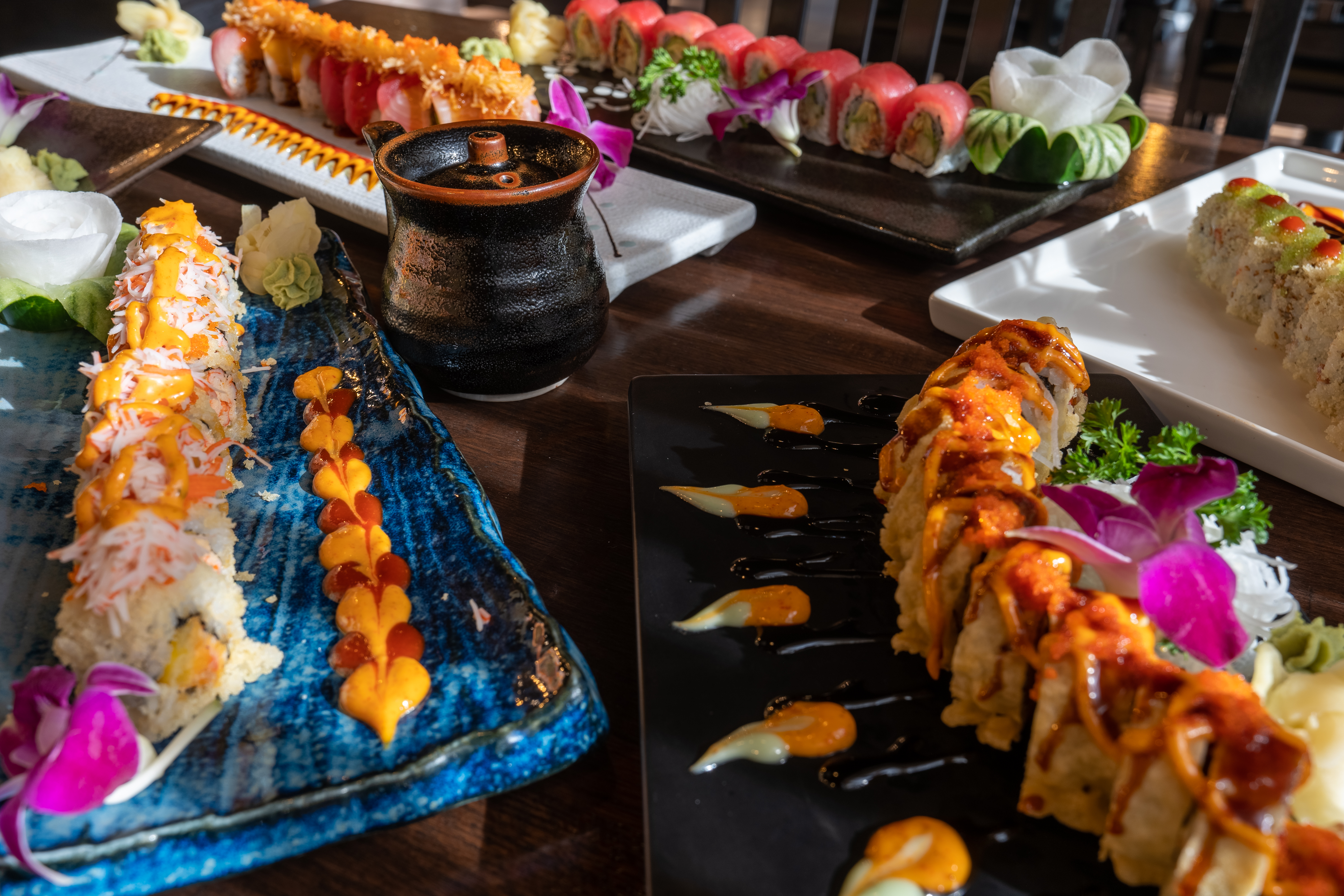 a plate of food with a slice of cake on a table