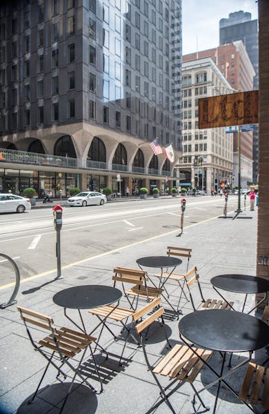 a chair sitting in front of a building