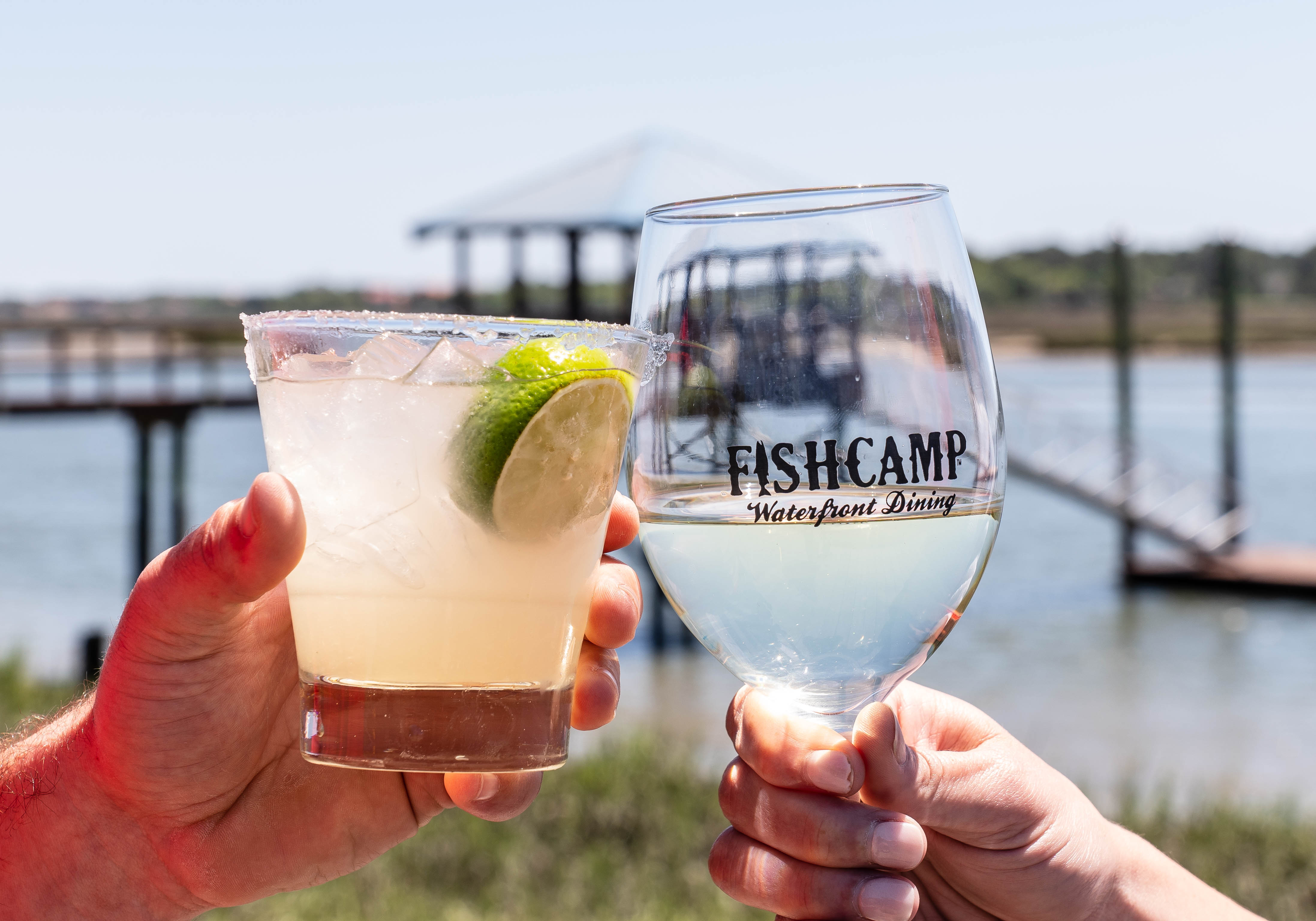 a hand holding a glass of water