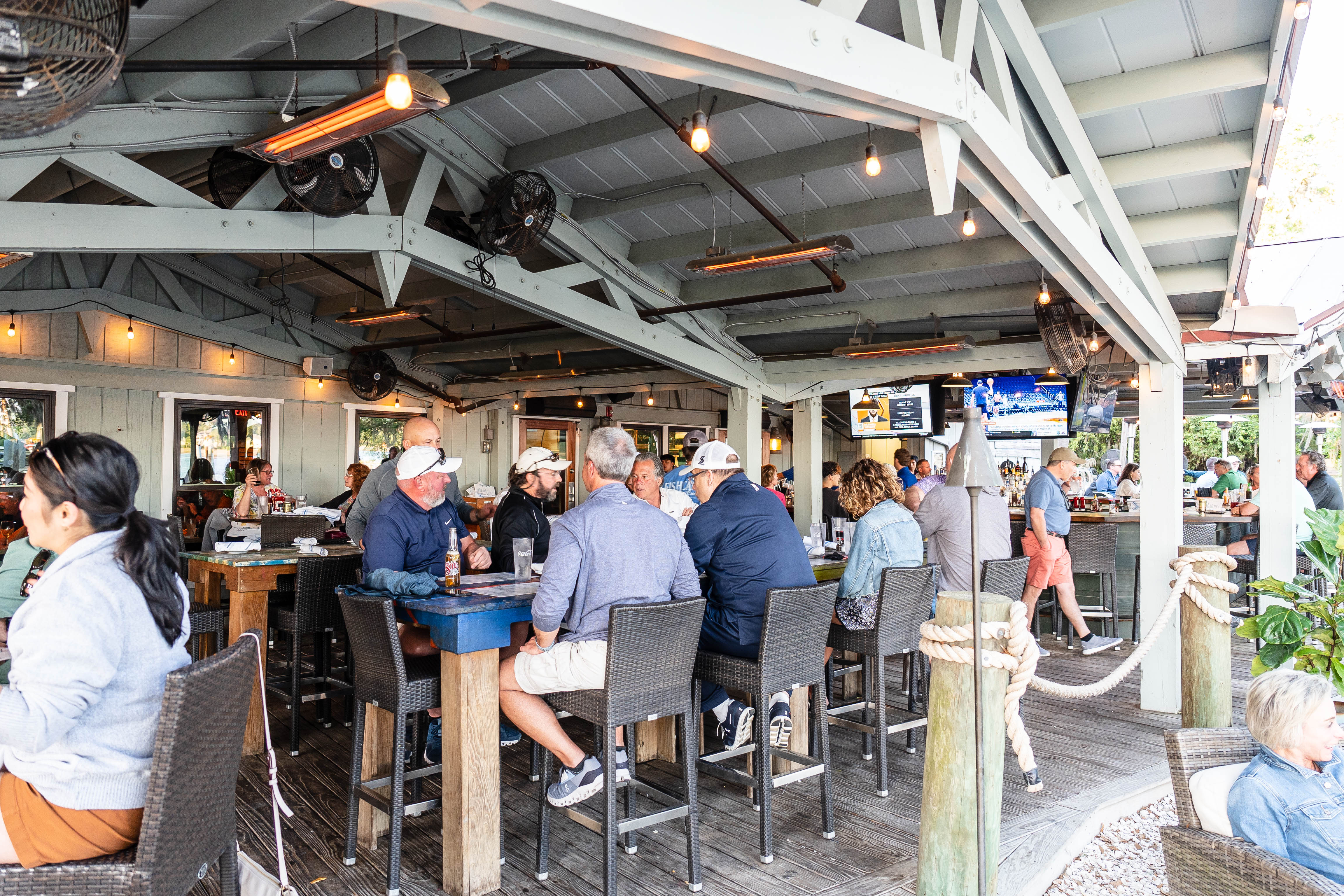a group of people standing around a table