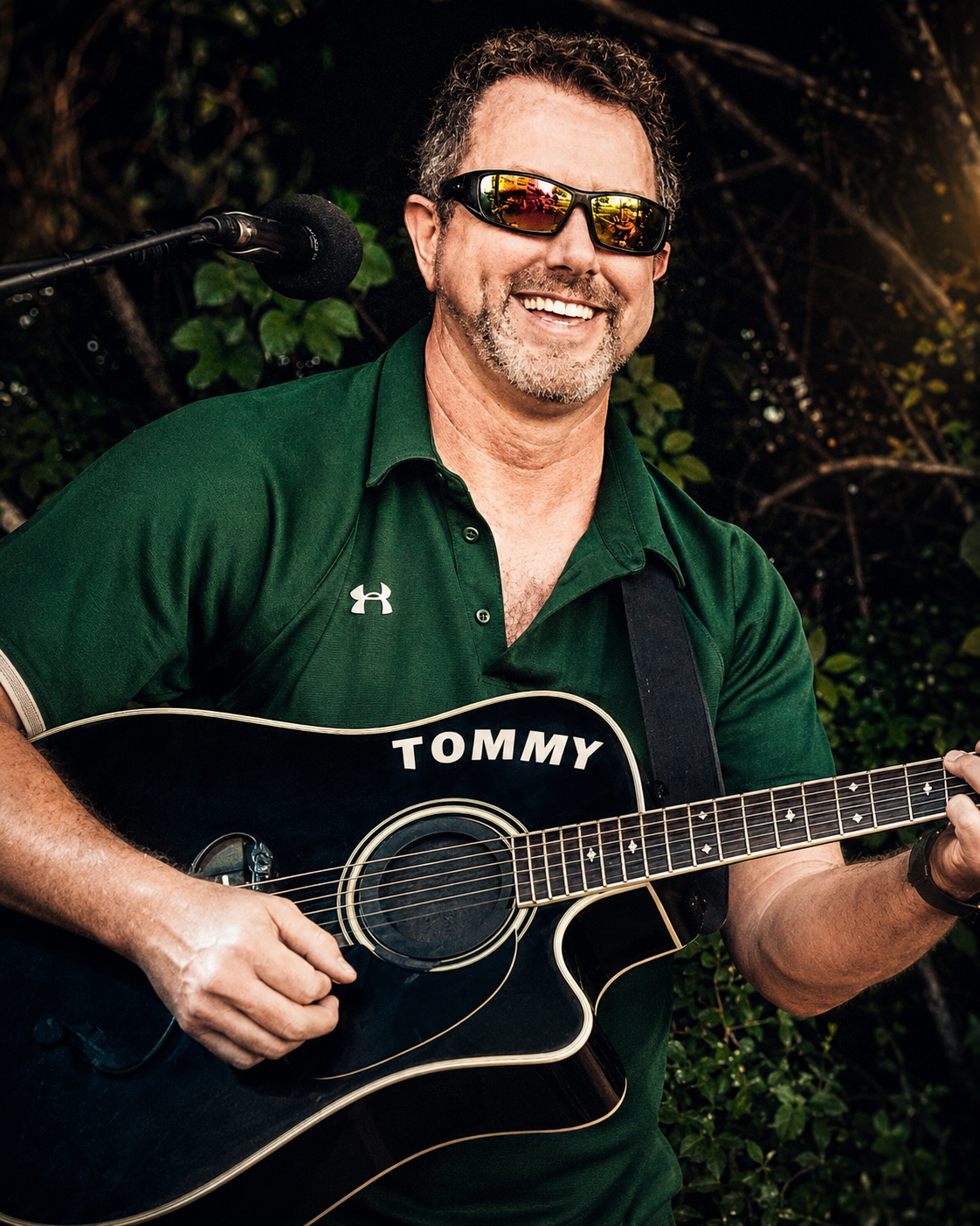 a man holding a guitar