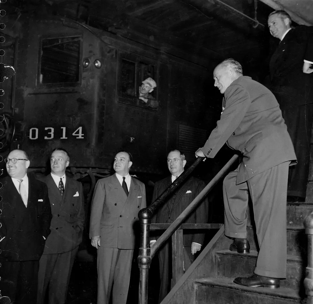 a group of people standing at a bar