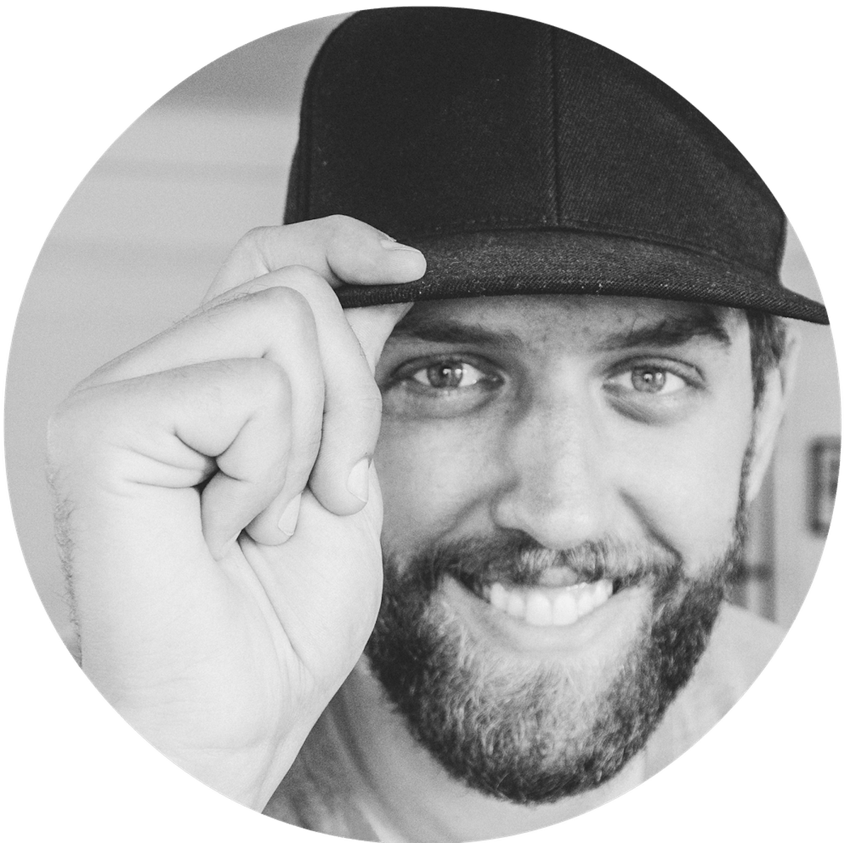 a man wearing a black hat