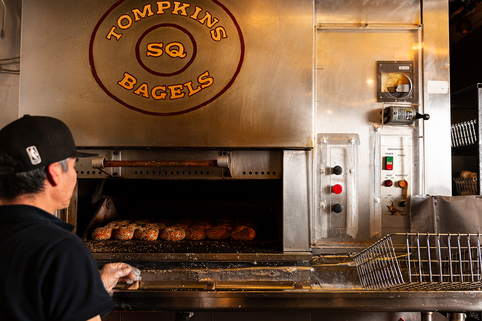 a man cooking in an oven