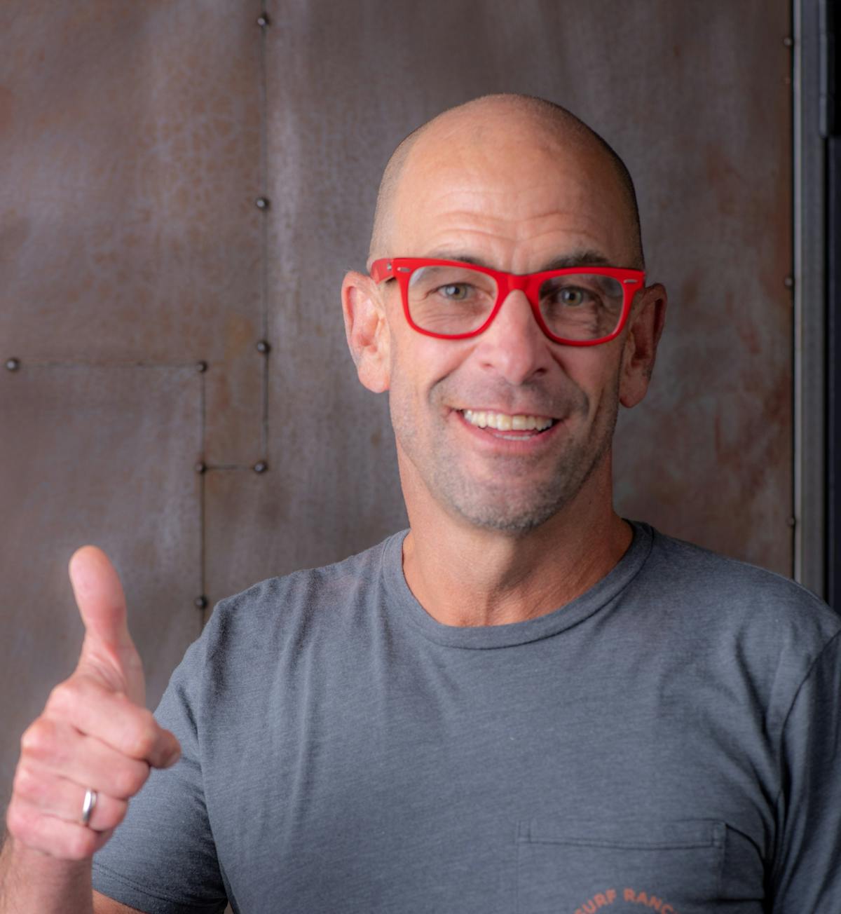 Victor Rallo wearing glasses and smiling at the camera