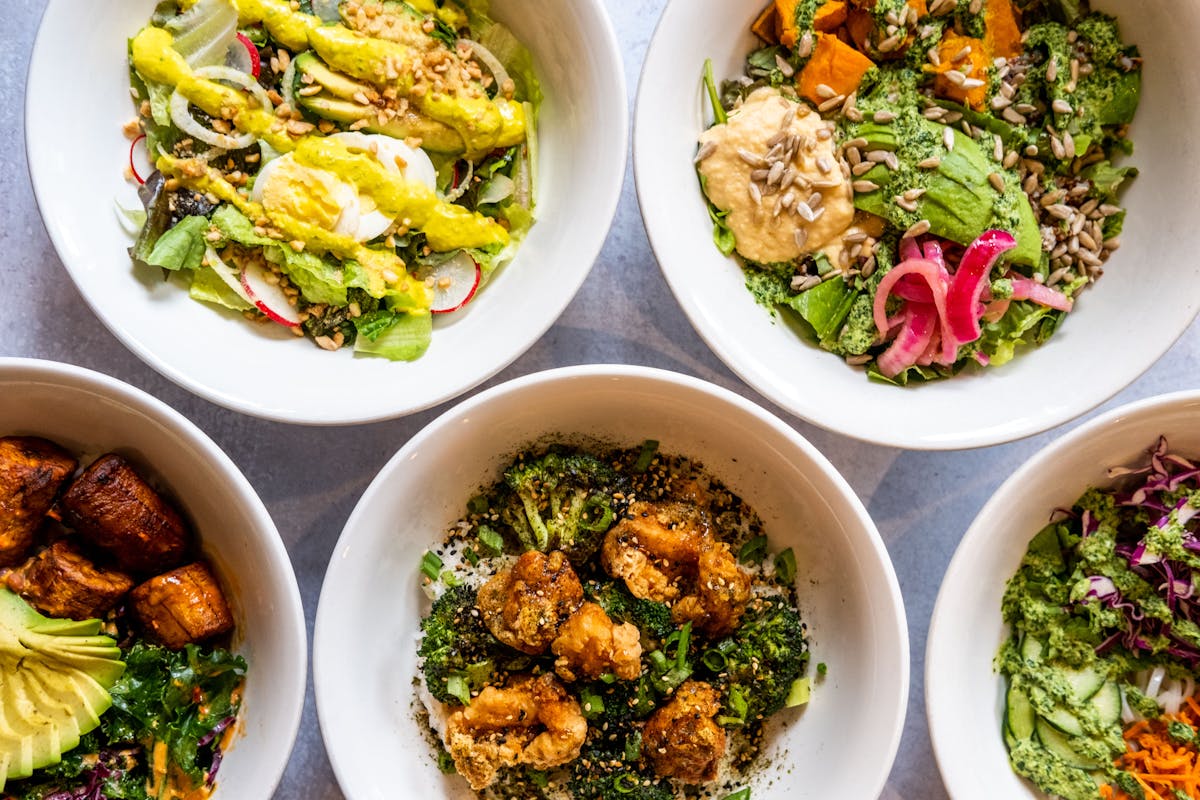 a bowl filled with different types of food on a plate