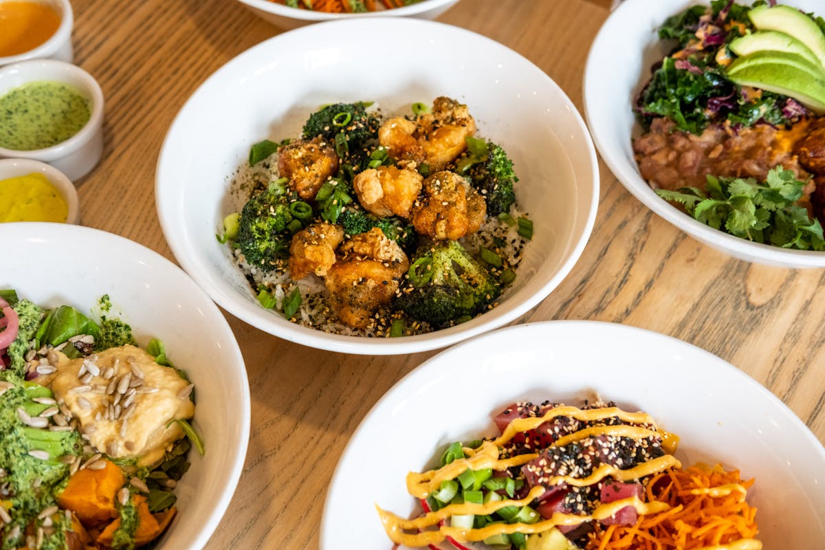 a bowl filled with different types of food on a table