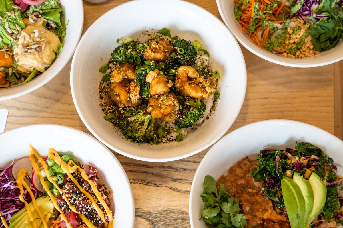 a bowl filled with different types of food on a table