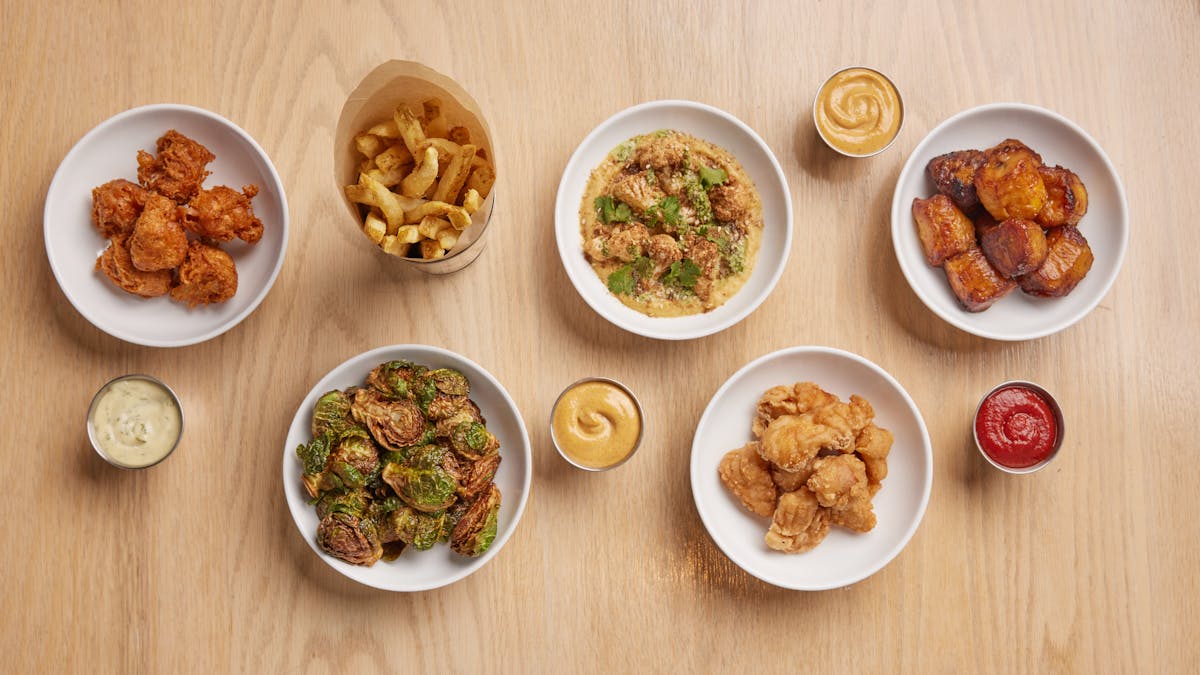 a collection of side dishes arranged on a table