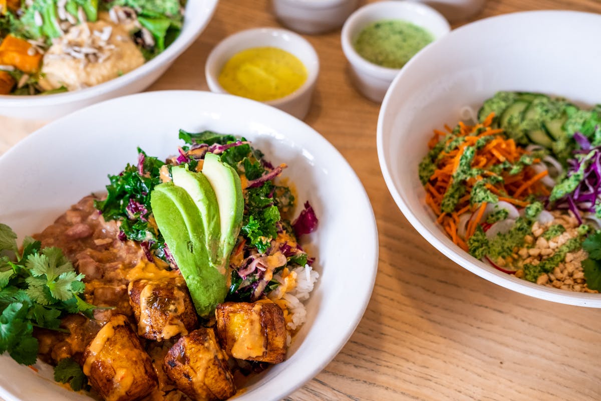 a bowl filled with different types of food on a plate