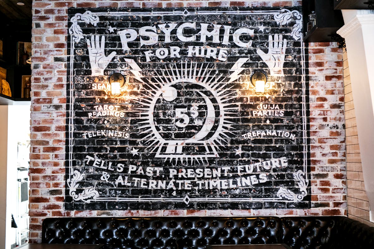 psychic for hire sign at Storm Crow Manor