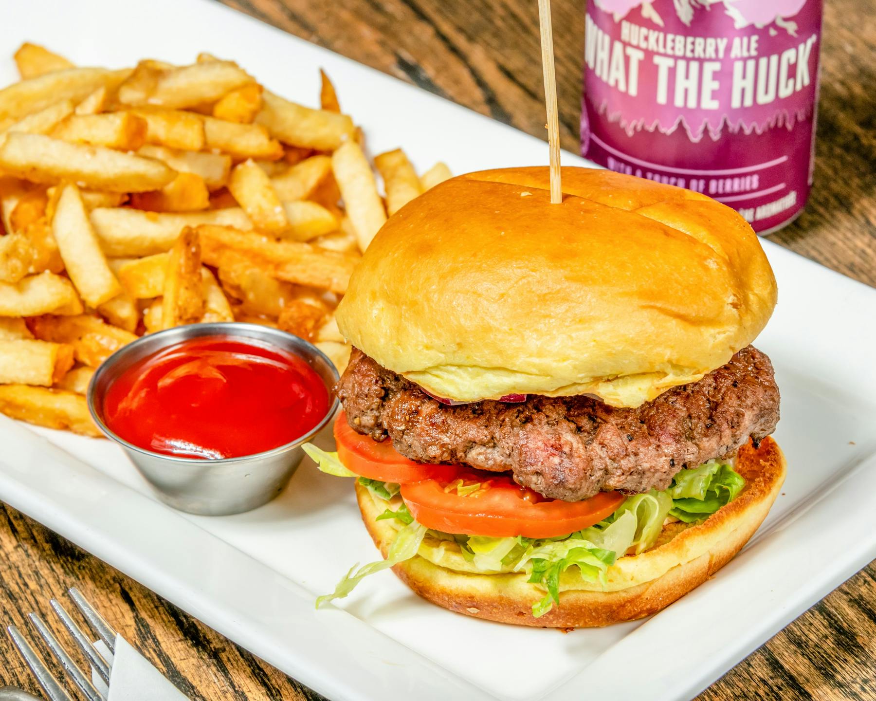 a close up of a burger and fries on a plate