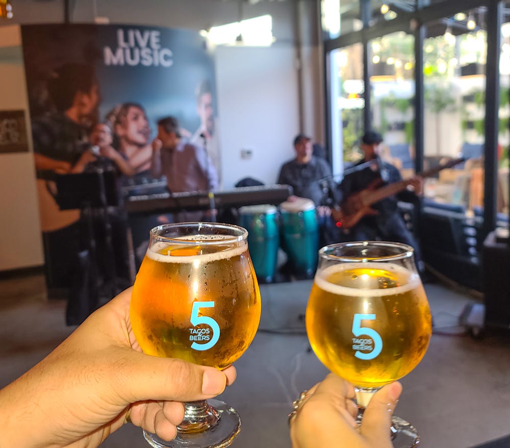 a person holding a glass of orange juice