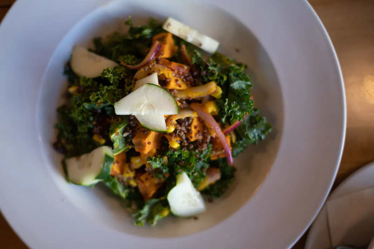 a bowl of food with broccoli