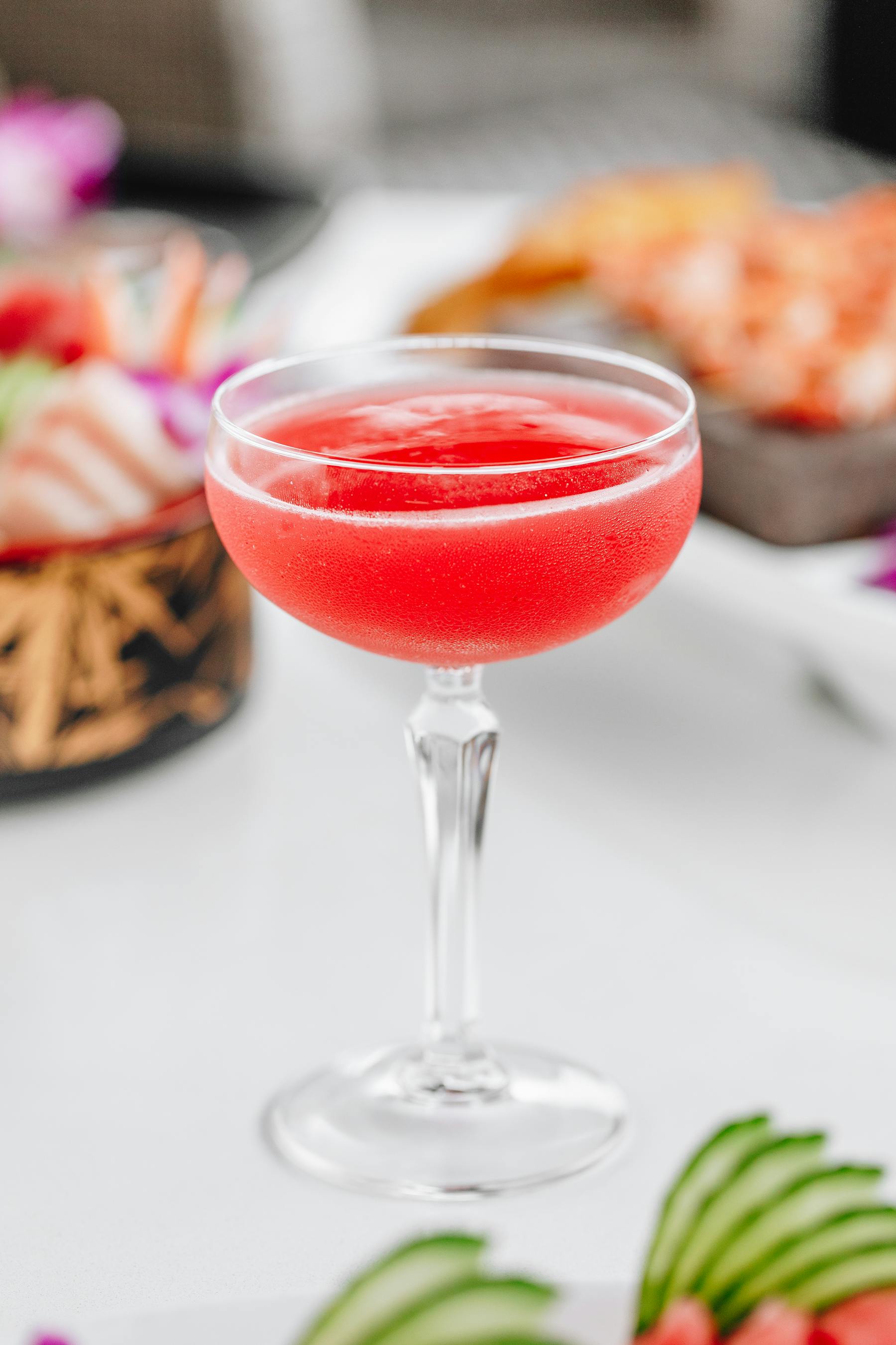 a close up of a wine glass on a table