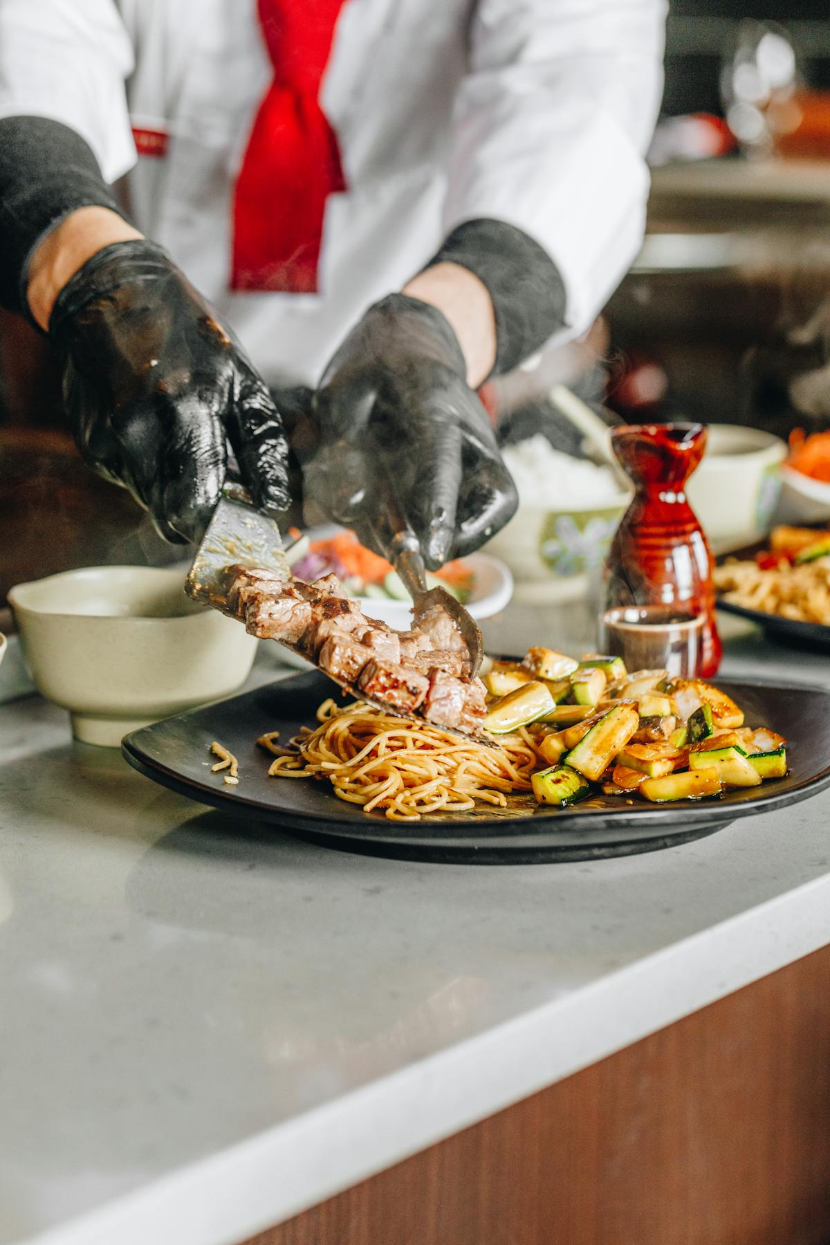 a person sitting at a table with a plate of food