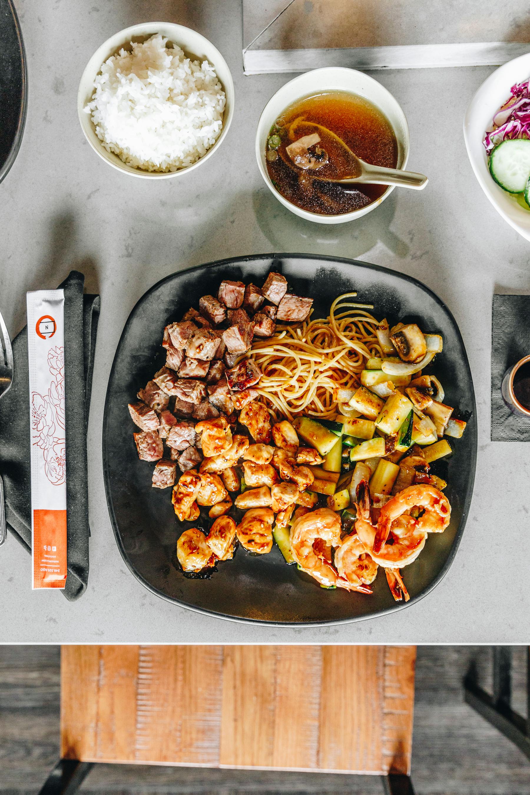 a bunch of food sitting on top of a wooden table