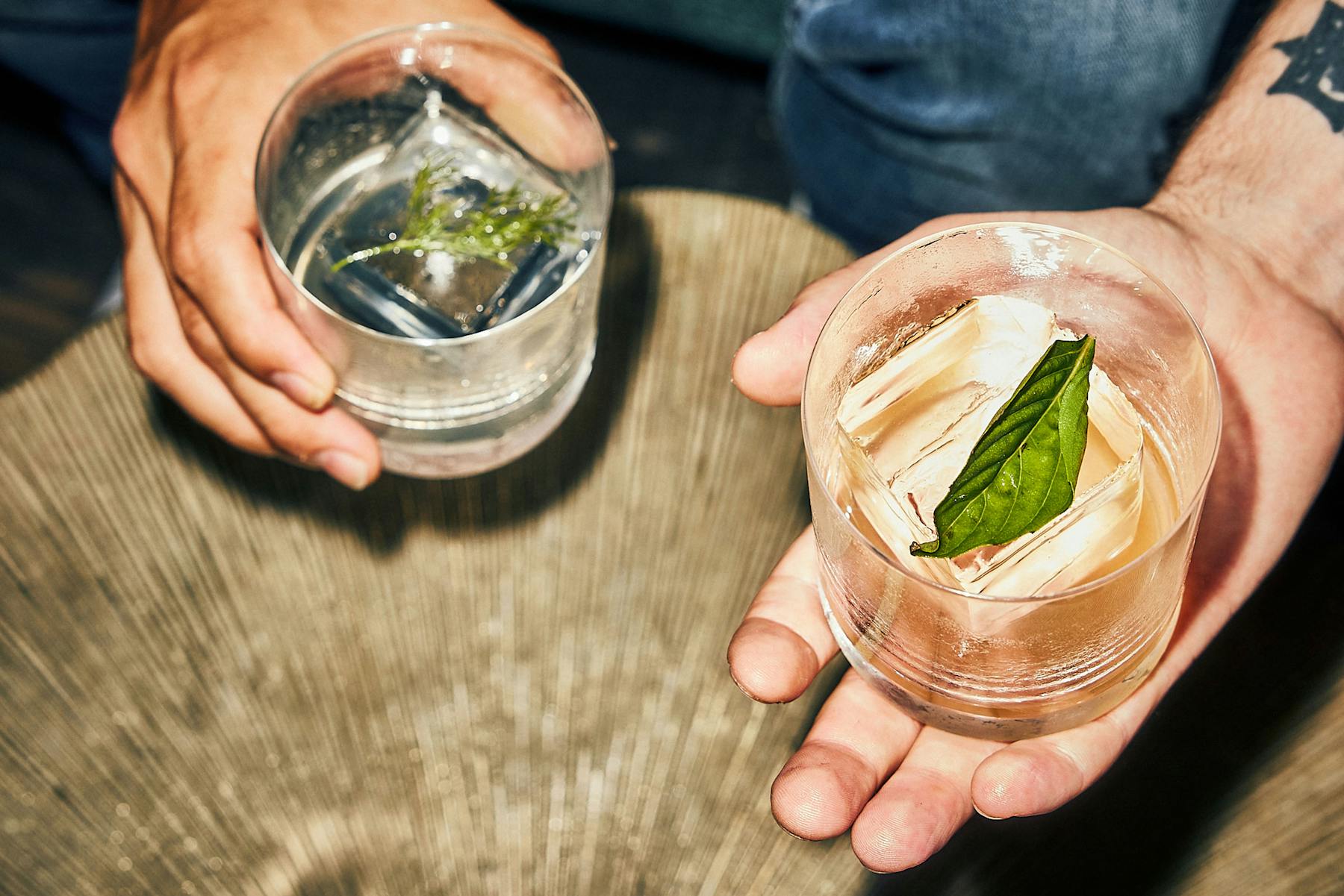 a hand holding a drink