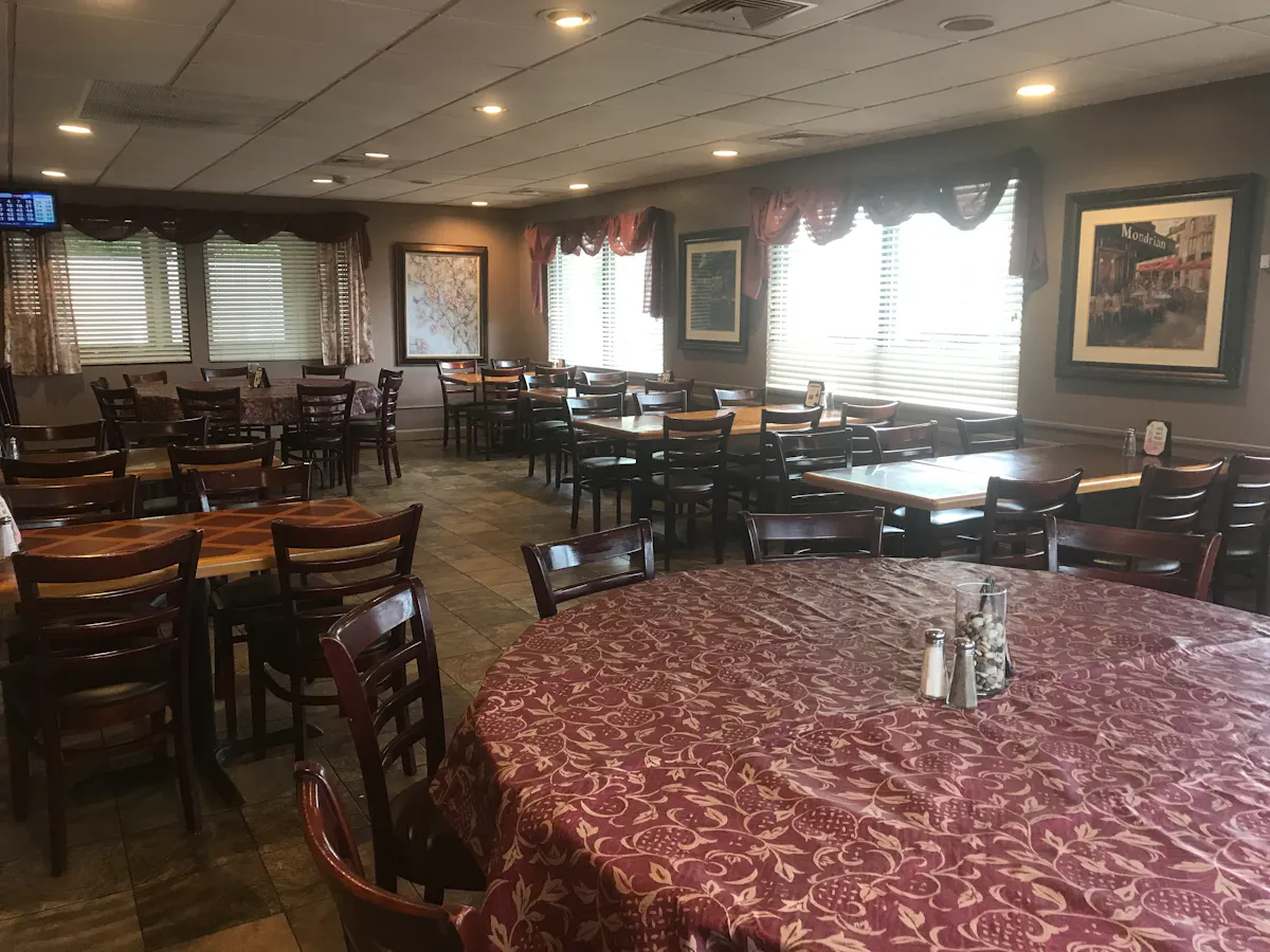 a room filled with furniture and a large window