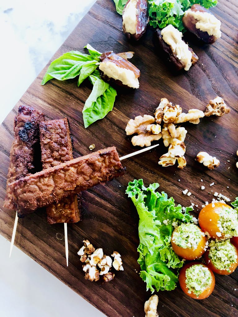 a bunch of food sitting on top of a cutting board with a cake