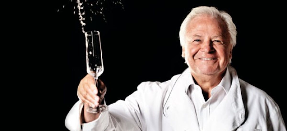a man holding a wine glass