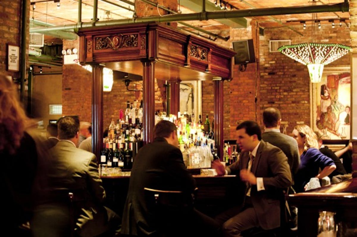 a group of people sitting in a restaurant