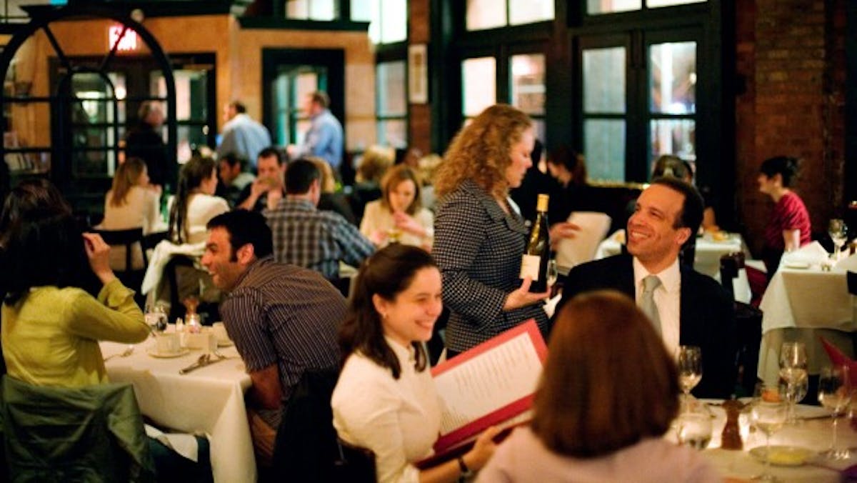 a group of people sitting at a table