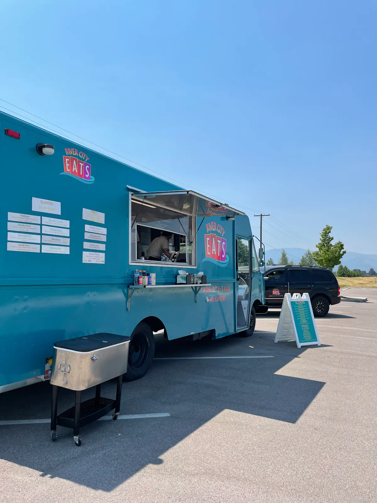 a blue truck parked in a parking lot
