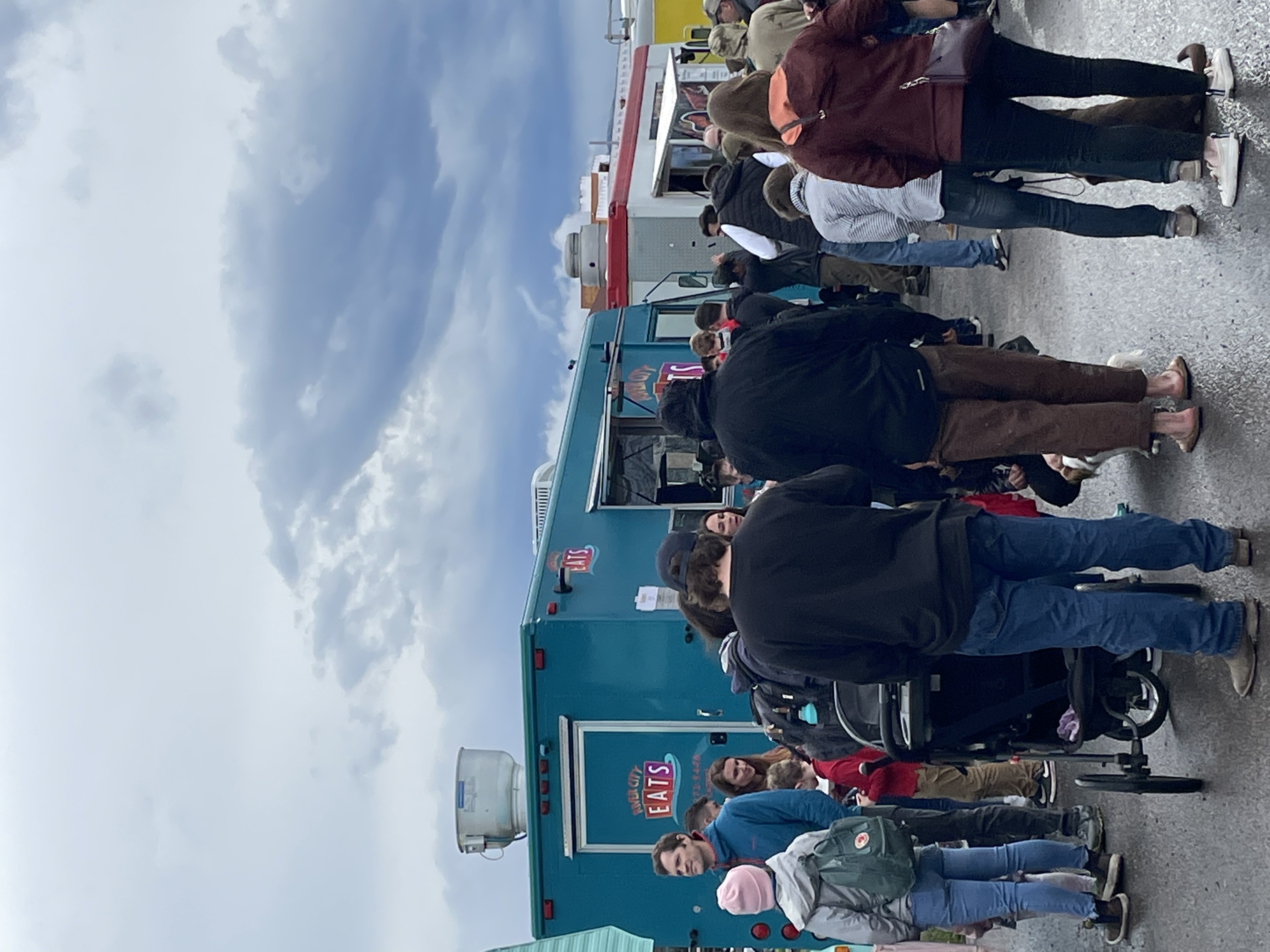 a group of people standing in front of a crowd