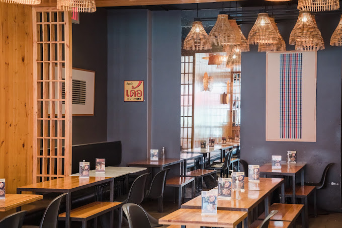 a kitchen with a table in front of a window