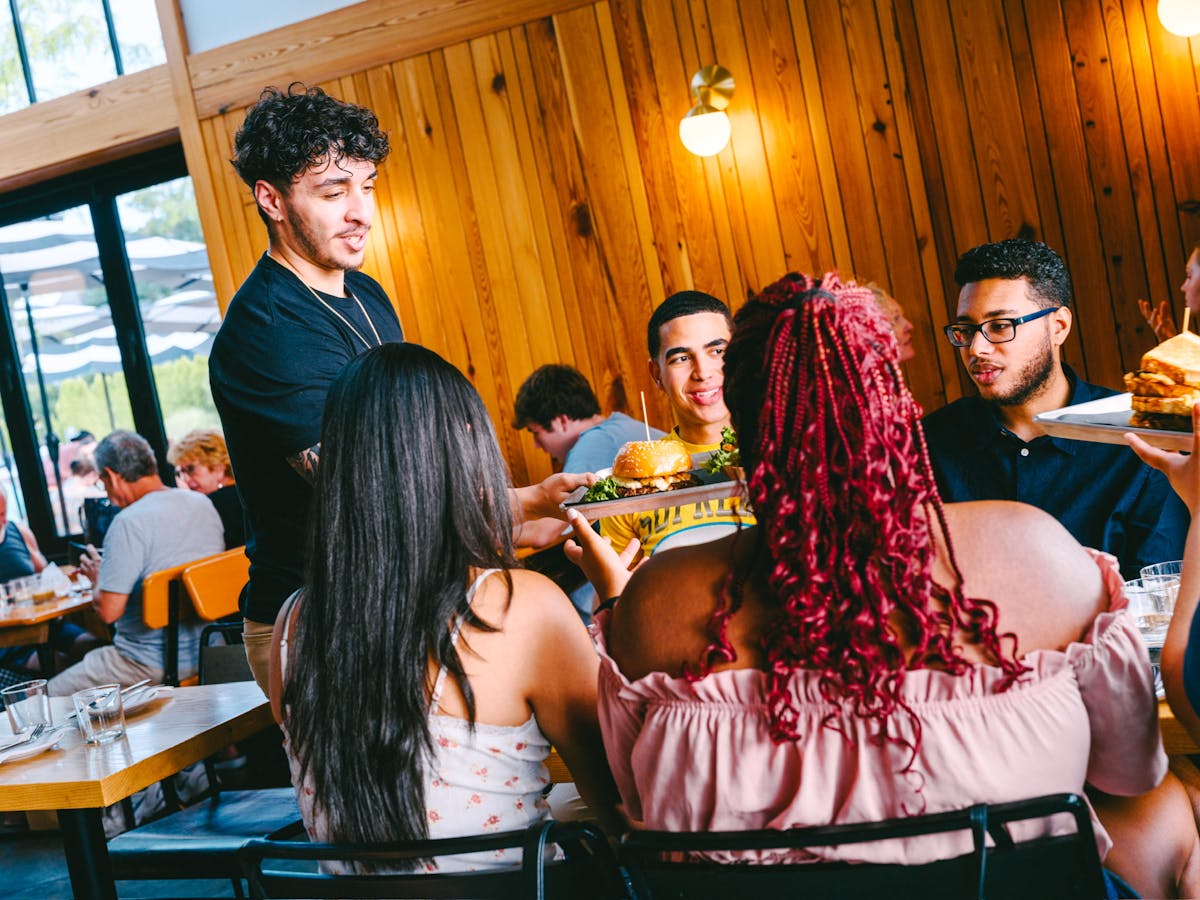 a group of people sitting at a table