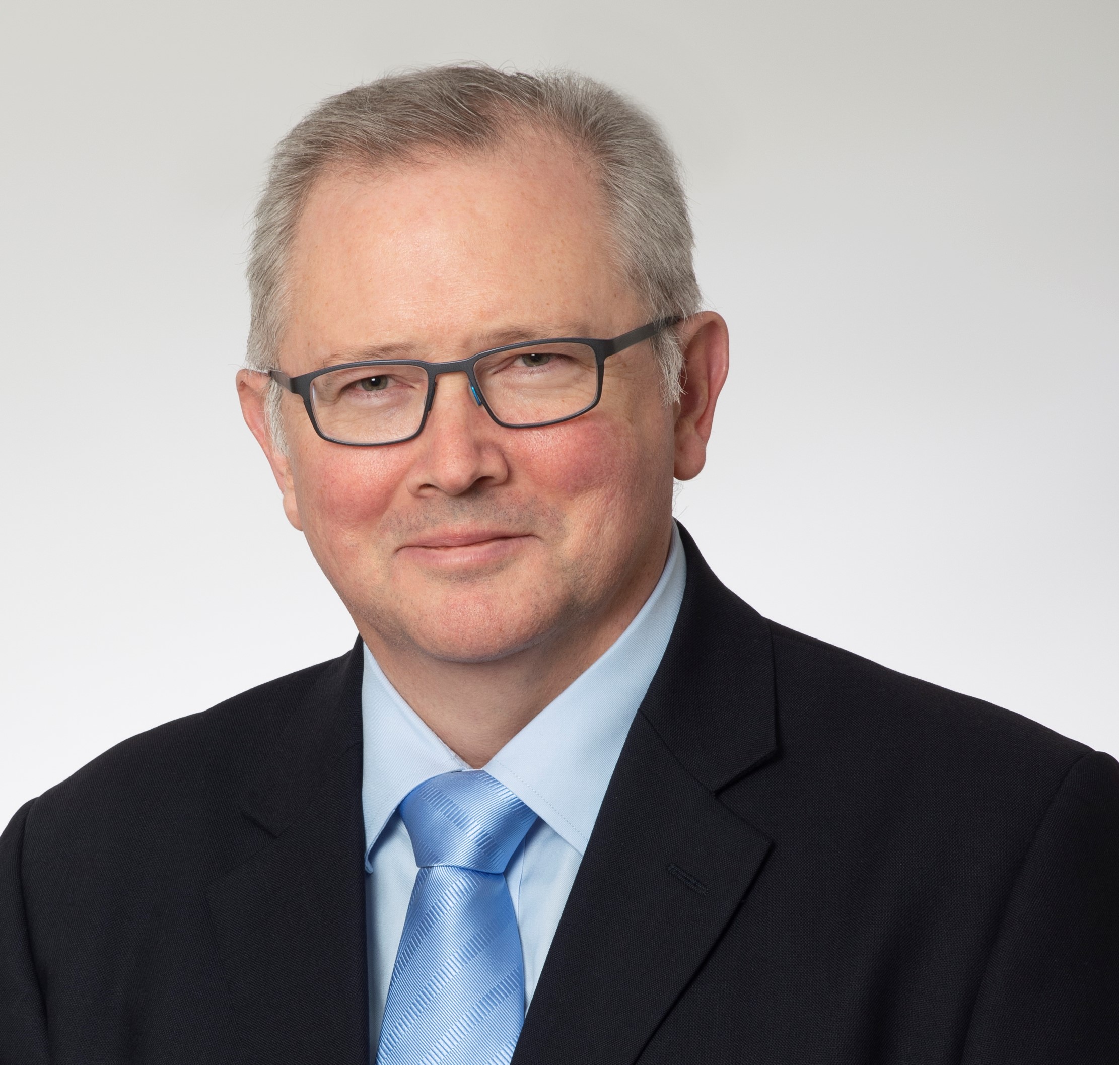 a man wearing a suit and tie