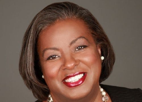 a close up of a person smiling for the camera