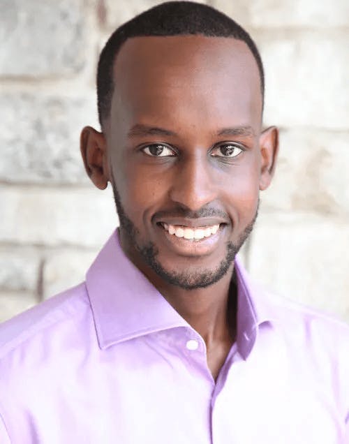 a man wearing a purple shirt