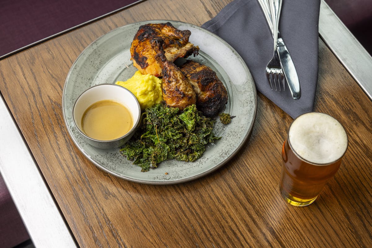 a plate of food with a fork and a cup of coffee