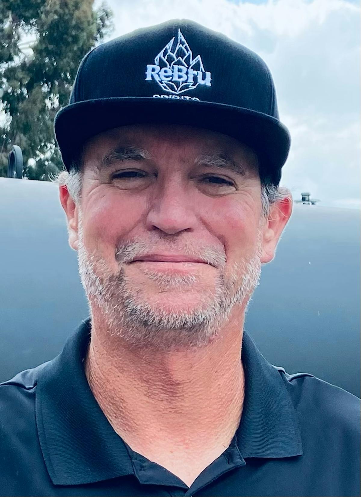 a close up of a man wearing a hat
