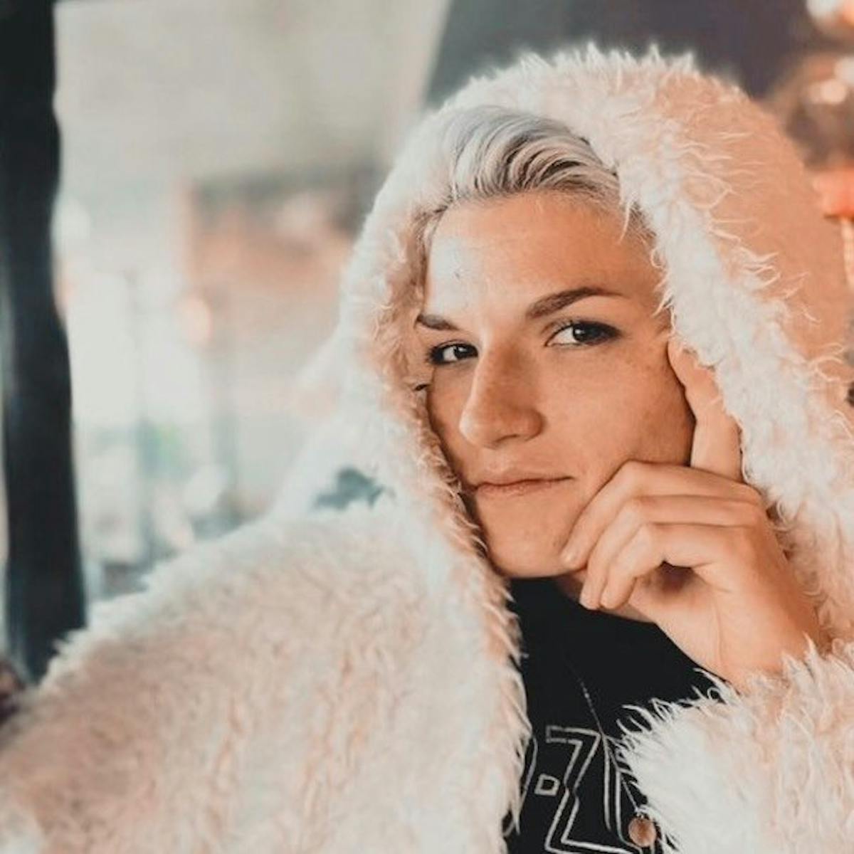 a woman holding a teddy bear