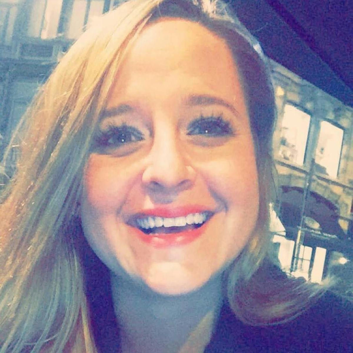 a woman smiling for the camera