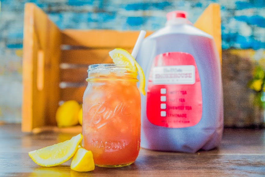 a close up of a glass of orange juice