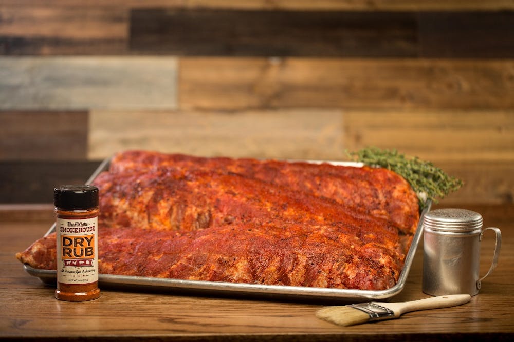 a pizza sitting on top of a wooden table