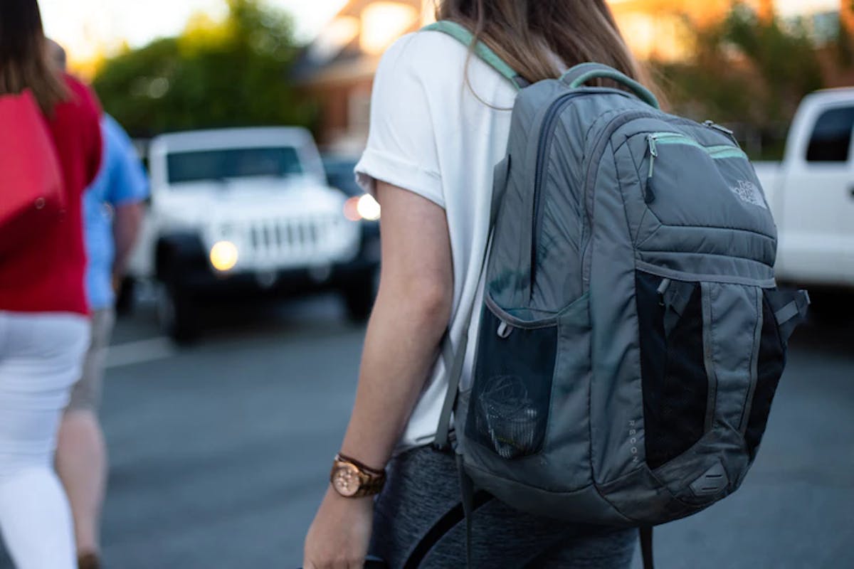 a woman walking down a street