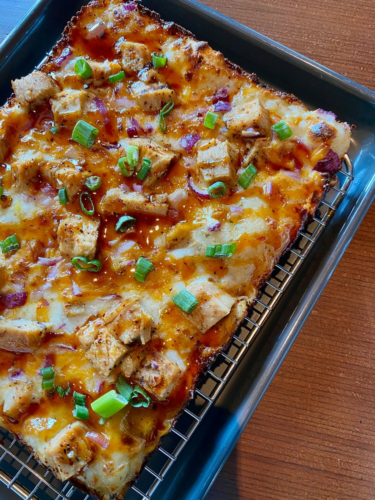 a pizza sitting on top of a pan on a table elkhorn