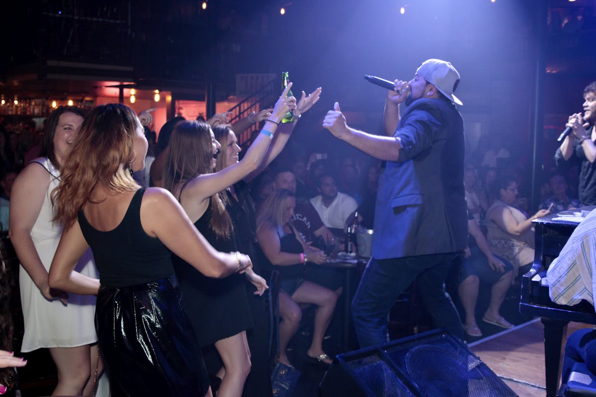 a group of people standing on a stage