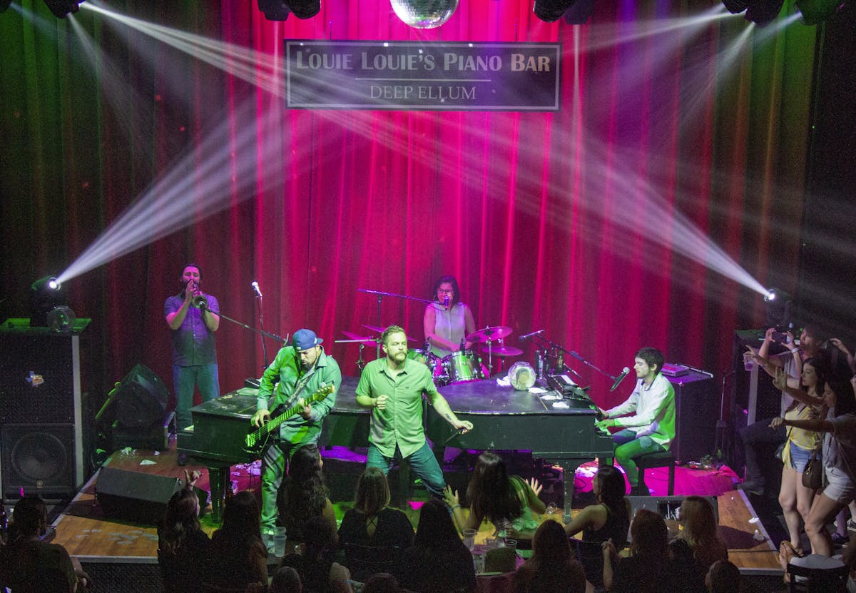 a group of people standing on a stage