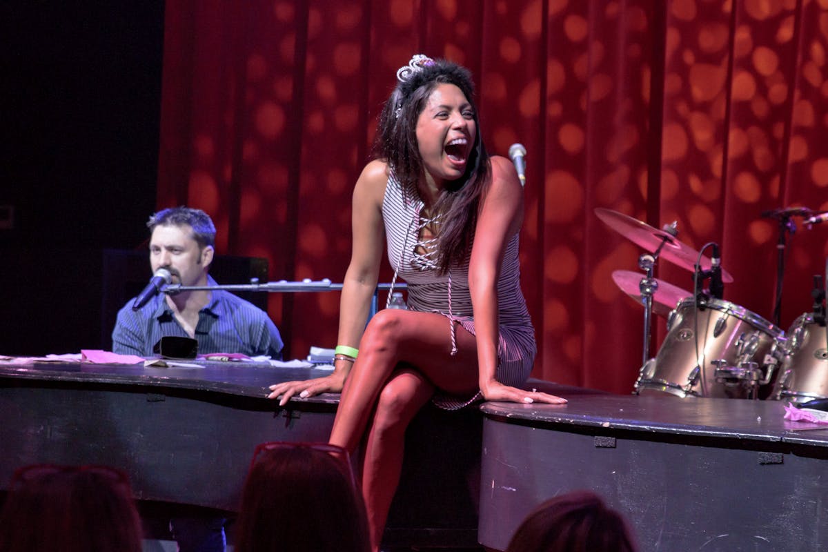 a woman sitting on a stage