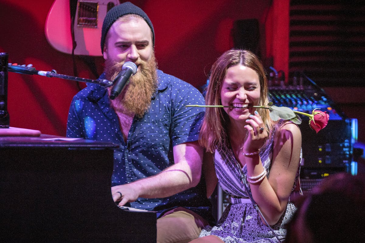 a person sitting on a stage