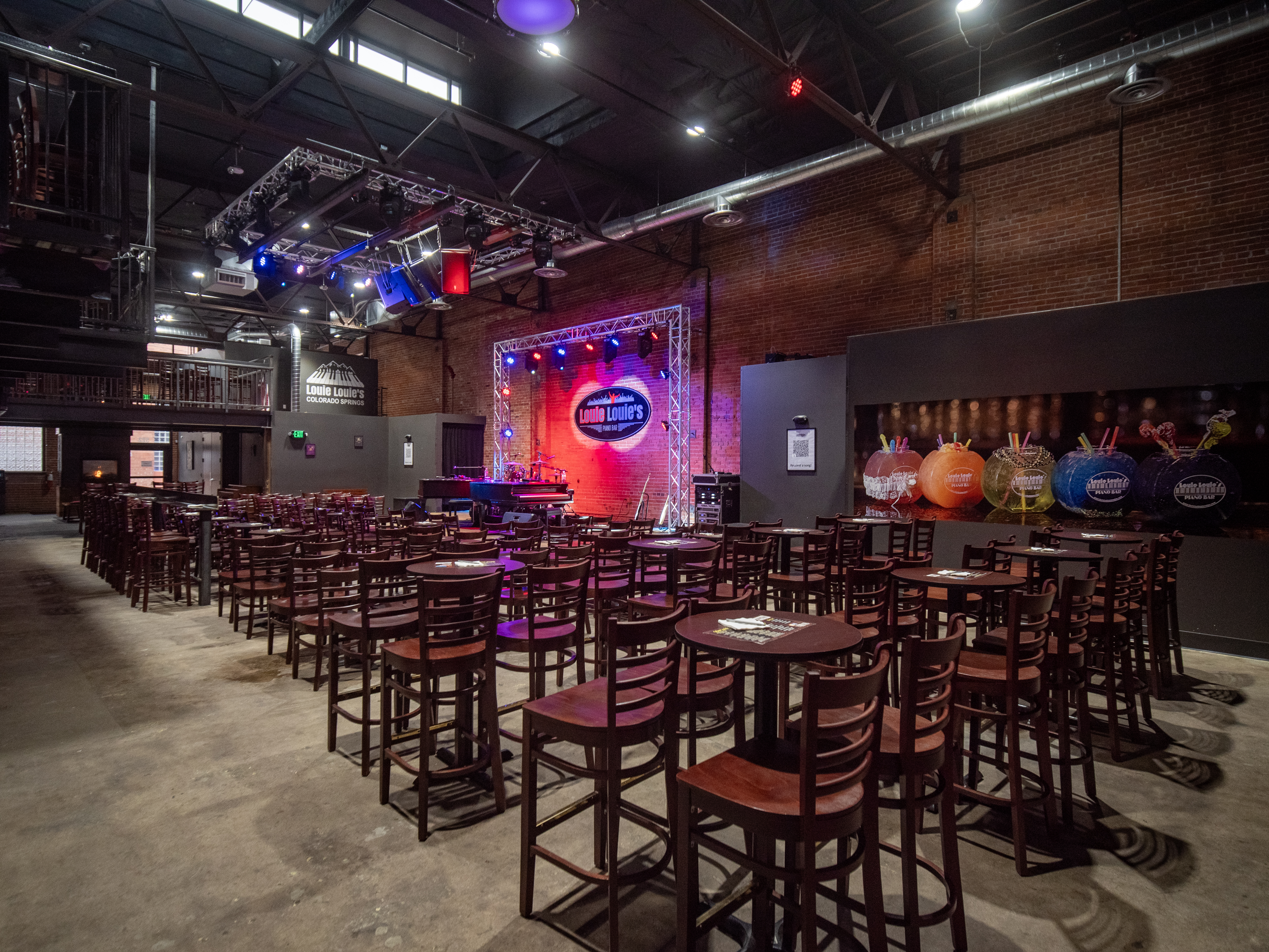 a group of people sitting at a table in front of a store