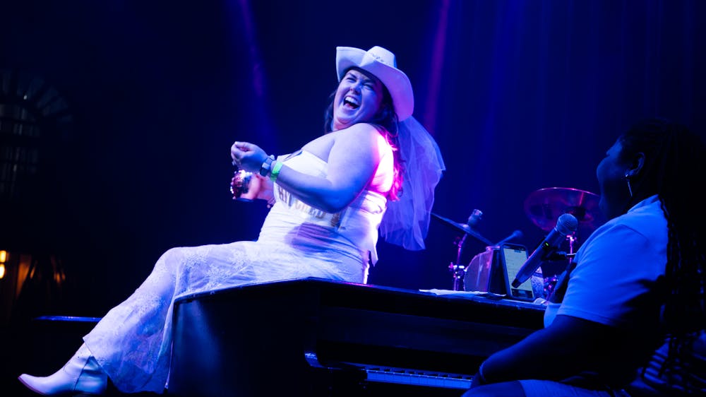 a person sitting on a stage