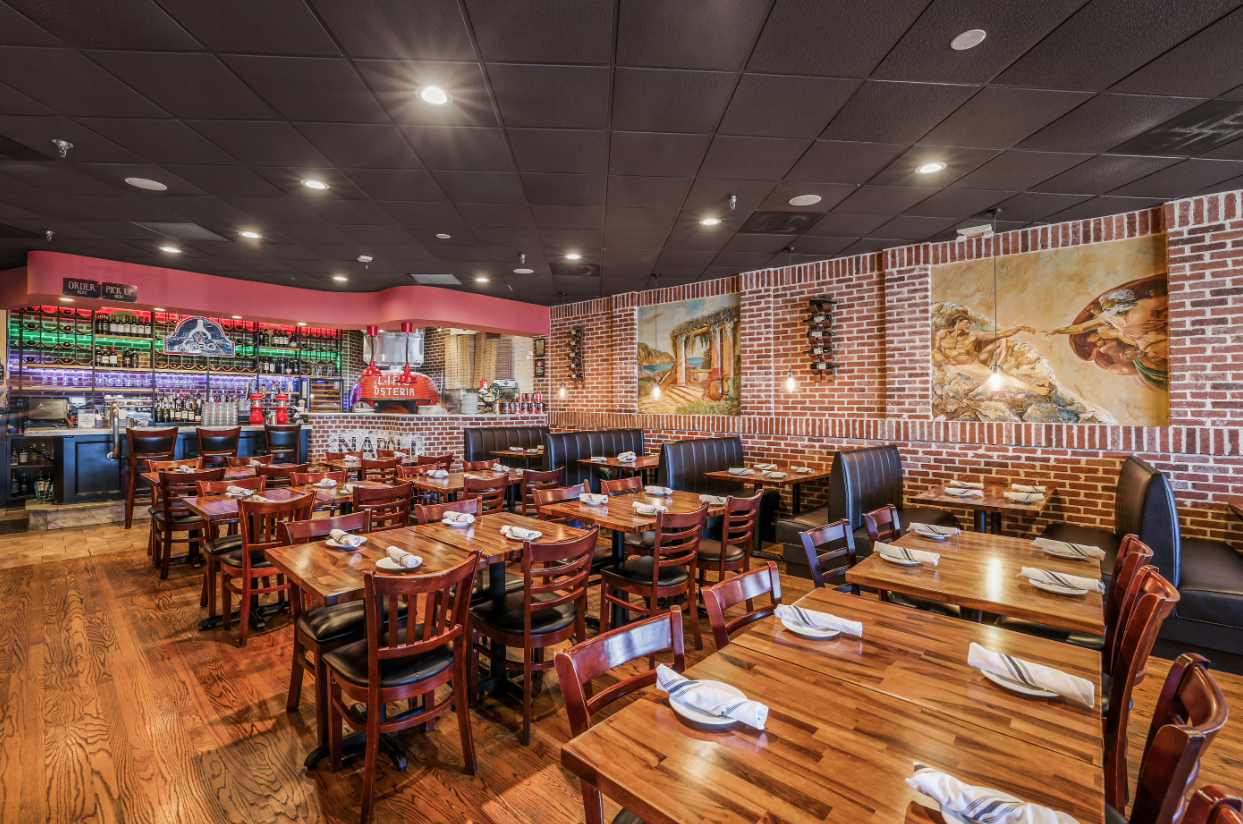 a room filled with furniture and a table in a restaurant
